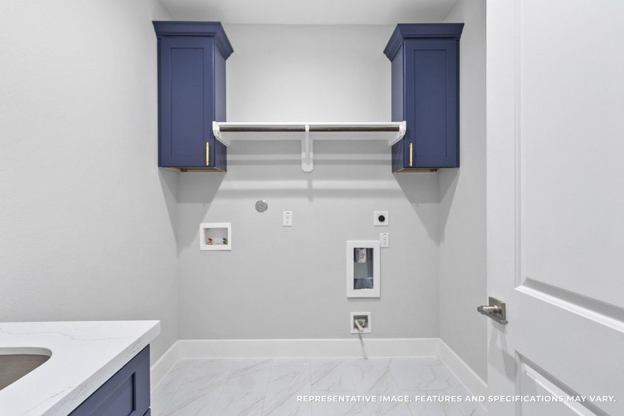 Laundry days are no longer a chore in your dedicated utility room. With sleek cabinetry for storage and open shelving for supplies, you keep everything tidy and accessible, making this space as functional as it is stylish. Laundry days are no longer a chore in your dedicated utility room. With sleek cabinetry for storage and open shelving for supplies, you keep everything tidy and accessible, making this space as functional as it is stylish.