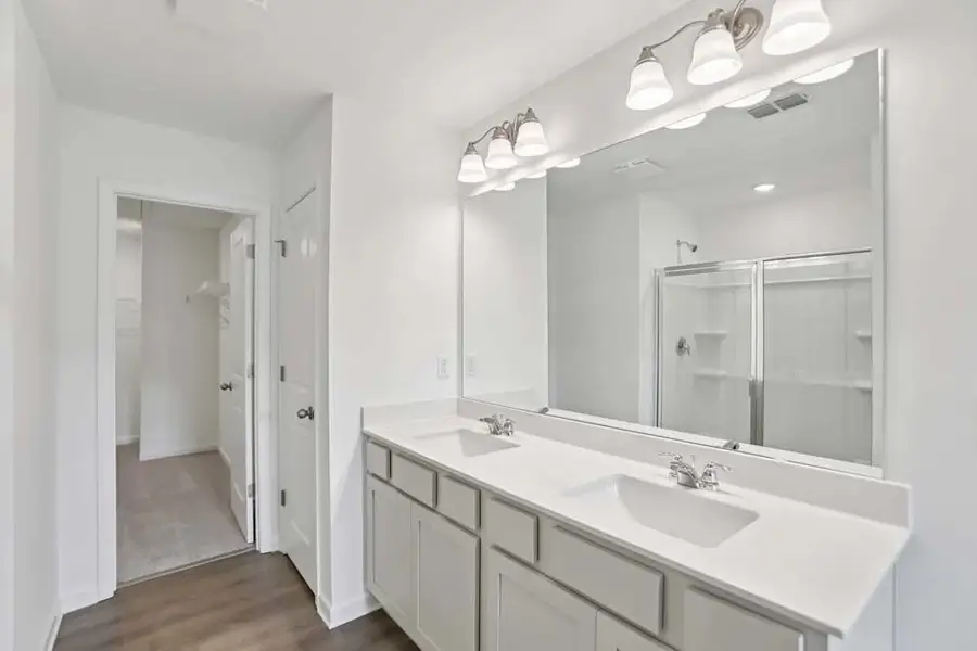 Sample Photo: Primary Bathroom Featuring Artisan Collection Finishes Sample Photo: Primary Bathroom Featuring Artisan Collection Finishes