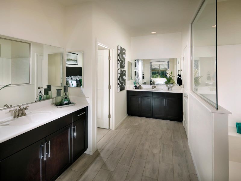 Plenty of space in this spa-like primary bath with two sinks.