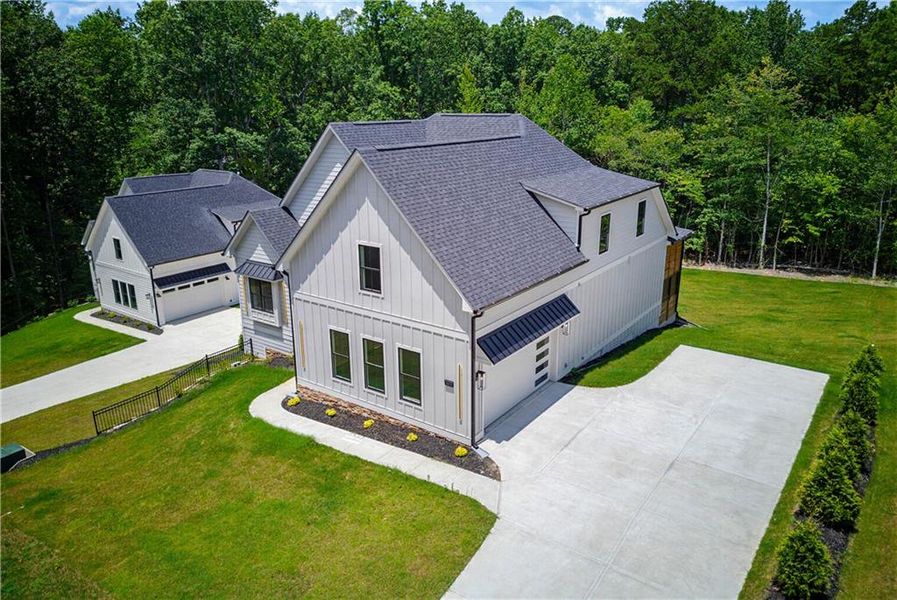 Front exterior of a new home in , Cumming, GA, highlighting curb appeal (Image 27).