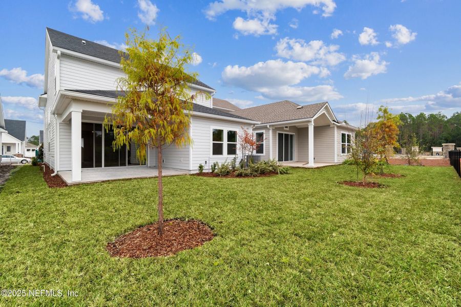 Exterior details and patio area of a home in Evergreen Island at Silverleaf - Classic, St. Augustine (Image 3).