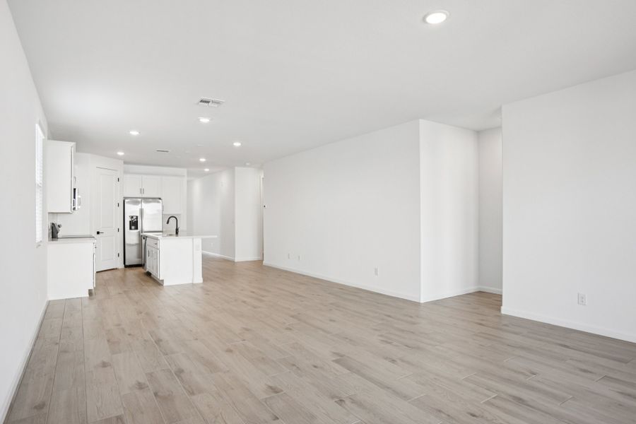 Great room and kitchen. Finishes and options may vary by community