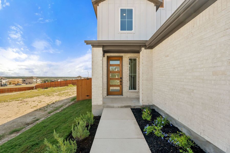 Exterior details and patio area of a home in Lariat, Liberty Hill (Image 3).