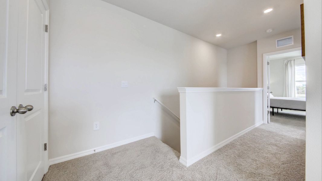 Representative unfurnished interior of a home built from the Vale by D.R. Horton in The Gardens at Bay Street, Sarasota (Image 22).