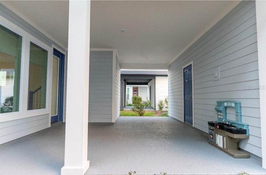 Exterior details and patio area of a home in Weslyn Park in Sunbridge 34', St. Cloud (Image 3).
