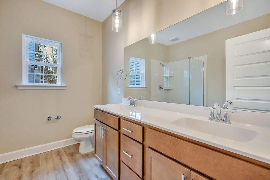Hatteras – Primary Bath with Pendant Lighting and Marble Shower