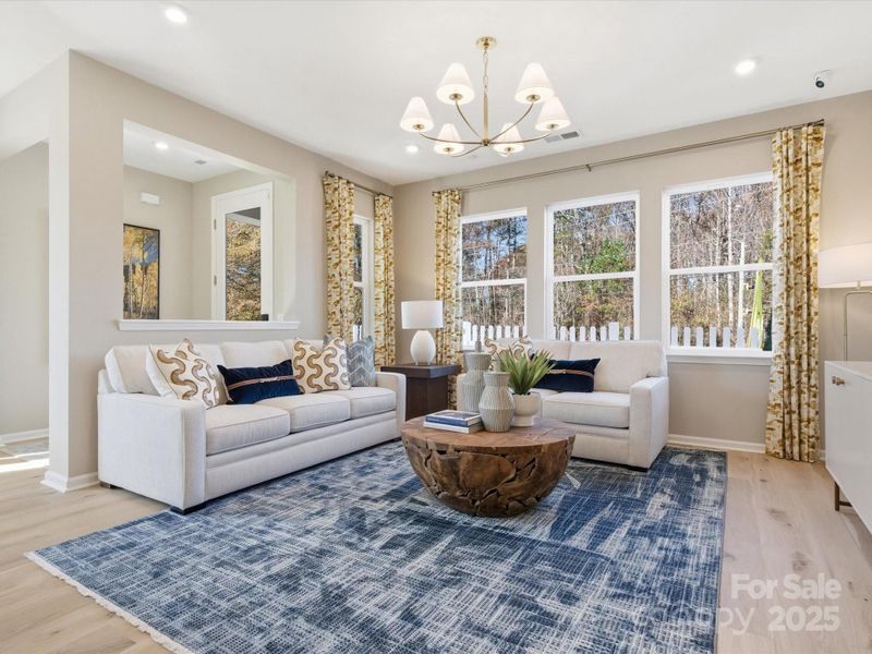 Great Room Surrounded by Light. *Model Photos | Actual Finishes, Structural Selections, and Orientation May Vary.