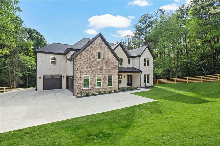 Front exterior of a new home in , Dacula, GA, highlighting curb appeal (Image 26).