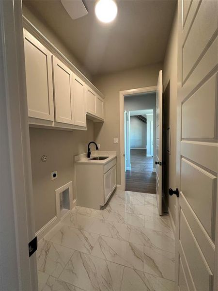 Primary closet conveniently connects to the utility room