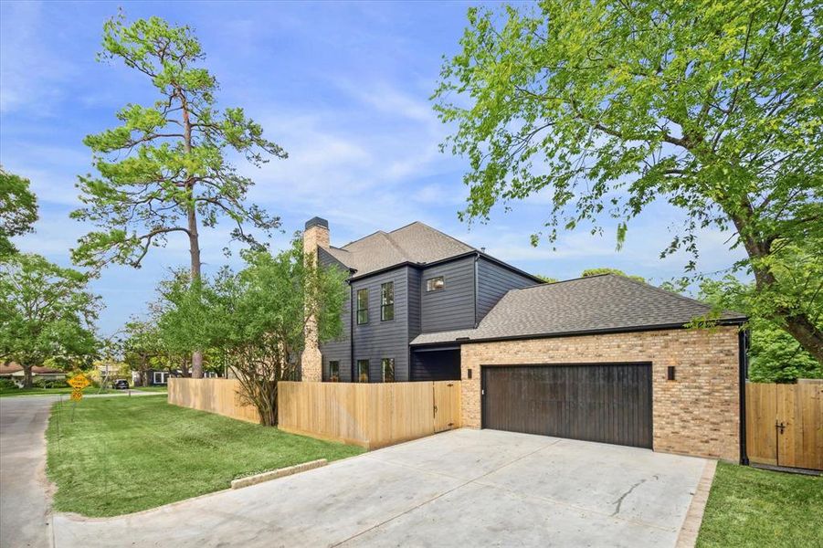 View of the oversized 2-car garage with double wide driveway for additional parking.