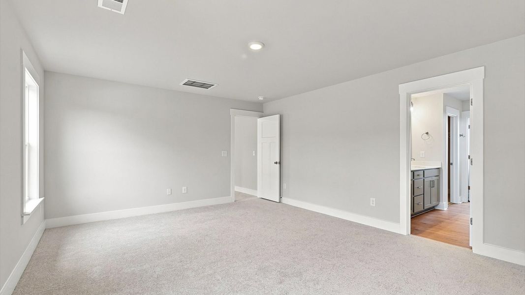 Spacious and serene primary suite with thoughtful design in a desirable DRB Homes community Spacious and serene primary suite with thoughtful design in a desirable DRB Homes community