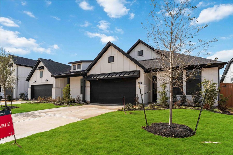 Front exterior of a new home in Elyson, Katy, TX, highlighting curb appeal (Image 2). Front exterior of a new home in Elyson, Katy, TX, highlighting curb appeal (Image 2).