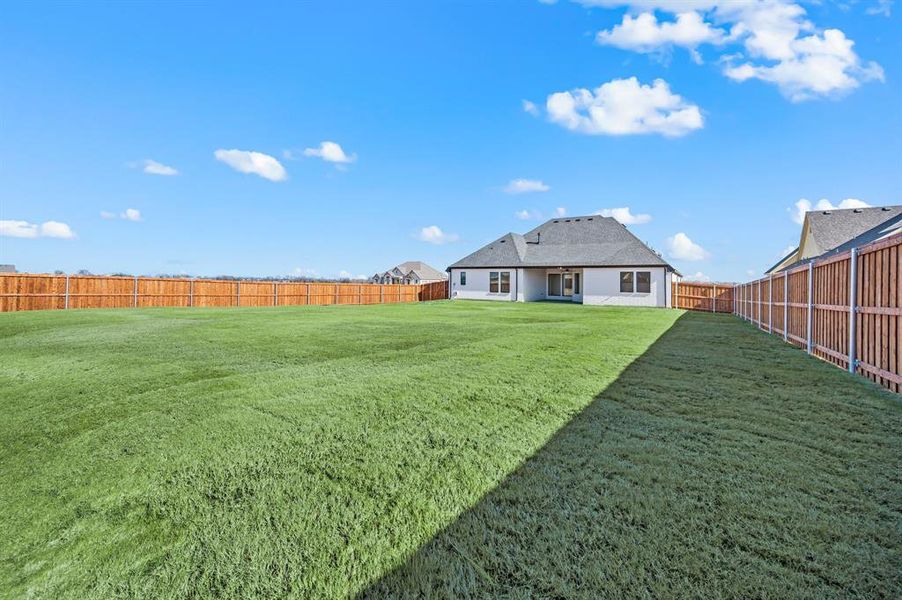 Exterior details and patio area of a home in Settlers Glen, New Fairview (Image 27).
