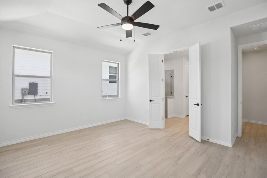Unfurnished bedroom with light wood-type flooring and a ceiling fan