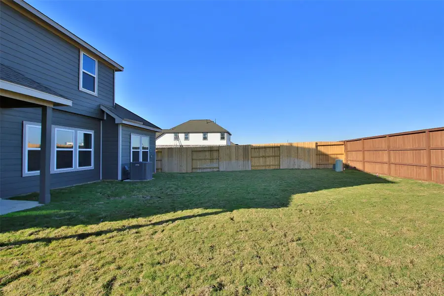 Exterior details and patio area of a home in Oakwood Estates, Waller (Image 3).