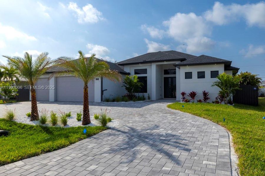 Front exterior of a new home in , Cape Coral, FL, highlighting curb appeal (Image 29).