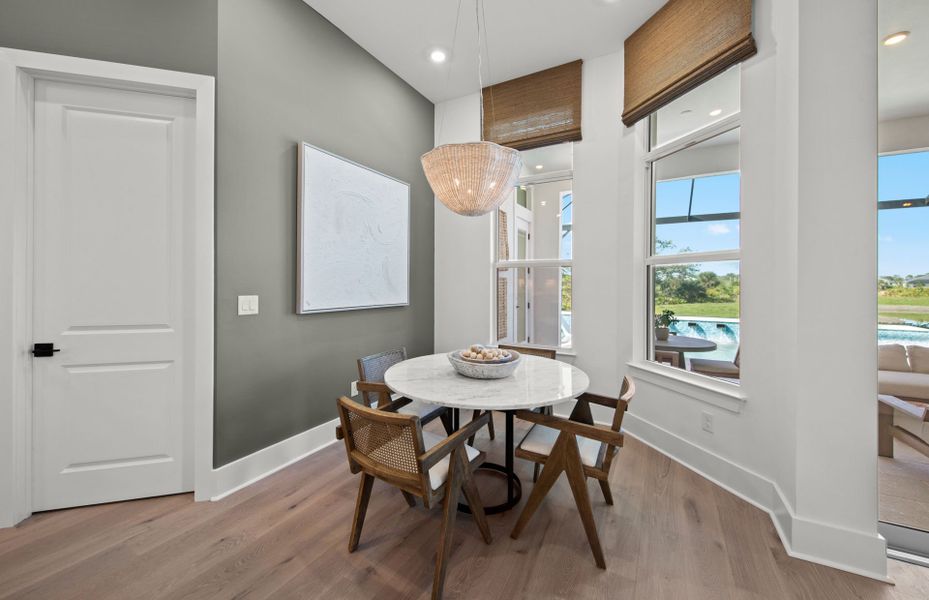 Representative furnished interior of a home built from the Layton Grande by DiVosta in BeachWalk by Manasota Key, Englewood (Image 29).