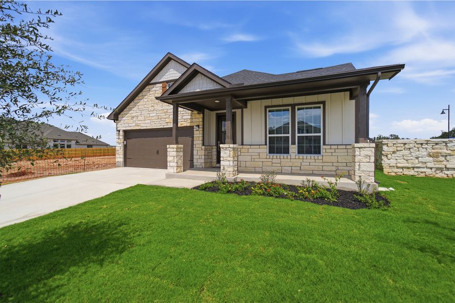 Front exterior of a new home in Santa Rita Ranch, Liberty Hill, TX, highlighting curb appeal (Image 2).