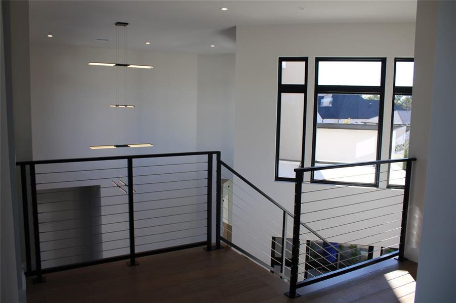 Staircase with hardwood / wood-style floors