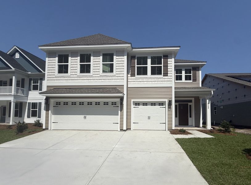 Front exterior of a new home in Arcadia, Myrtle Beach, SC, highlighting curb appeal (Image 1). Front exterior of a new home in Arcadia, Myrtle Beach, SC, highlighting curb appeal (Image 1).
