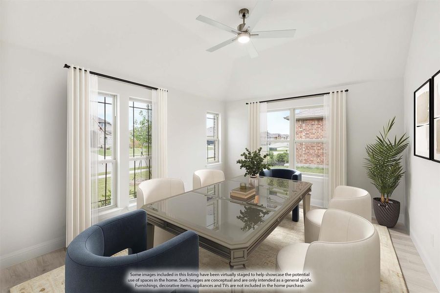 Dining room with glass-top table, white and navy chairs, ceiling fan, and large windows with natural light