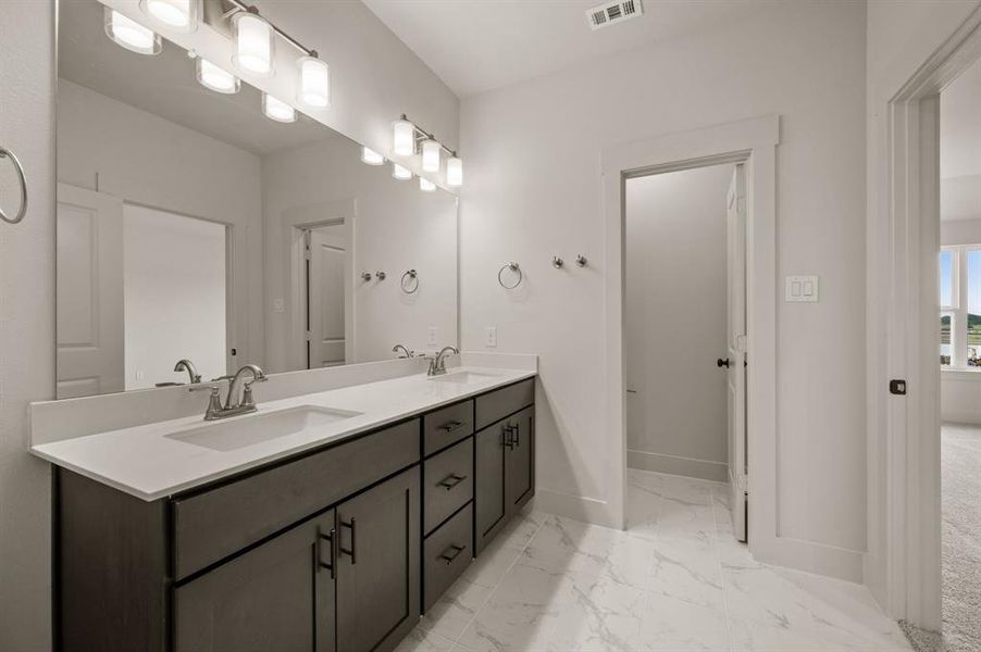 You'll find ample room for two in this stylish owner's bath!
