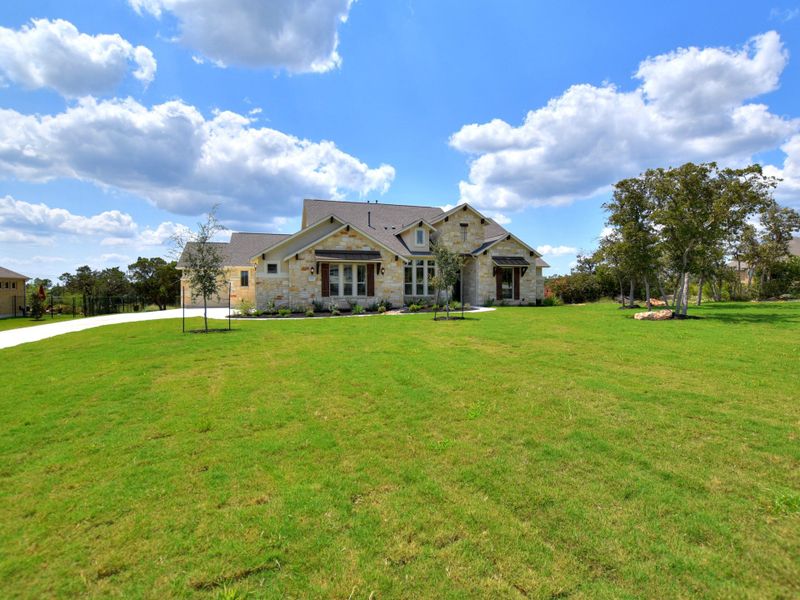 Representative exterior photo of a completed home built from the San Simeon II by Giddens Homes in Clearwater Ranch, Liberty Hill, TX (Image 29).