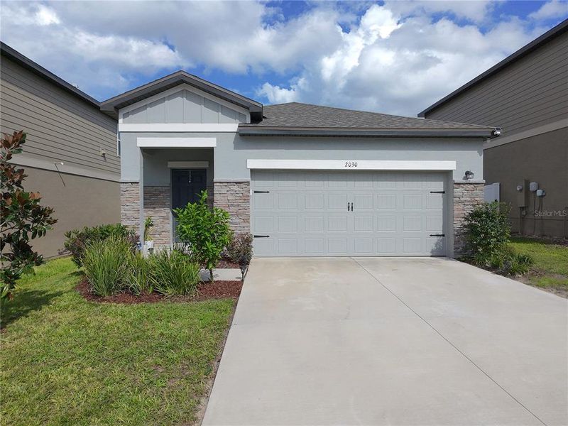 Front exterior of a new home in , Groveland, FL, highlighting curb appeal (Image 16).