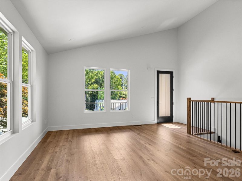 LIVING ROOM AREA WITH HIGH CEILINGS