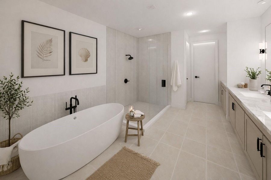 The primary bathroom feels like a private spa showcasing designer finishes and a well-appointed layout designed for comfort and relaxation.