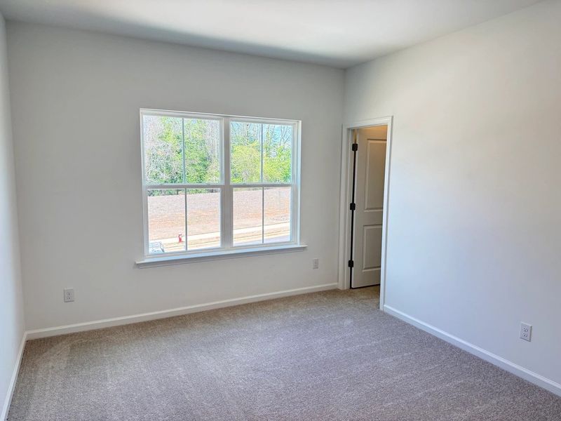 Spacious, unfurnished interior of a new home in Rowland's Grant, Fuquay Varina (Image 22).