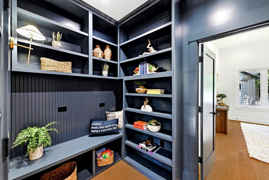 A well-appointed library nook features built-in shelving, providing both storage and a cozy reading spot. A well-appointed library nook features built-in shelving, providing both storage and a cozy reading spot.