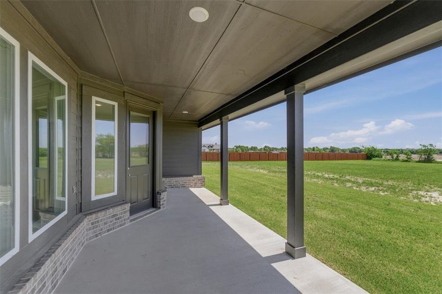Covered patio with concrete flooring Covered patio with concrete flooring