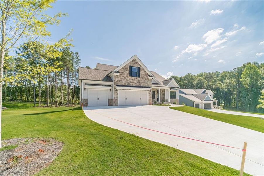 Front exterior of a new home in , Loganville, GA, highlighting curb appeal (Image 23).