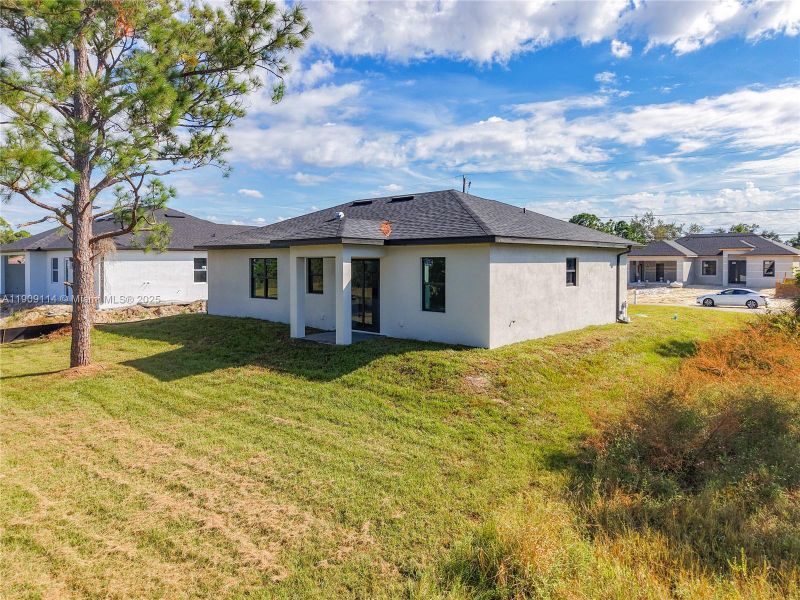 Exterior details and patio area of a home in , Lehigh Acres (Image 1).