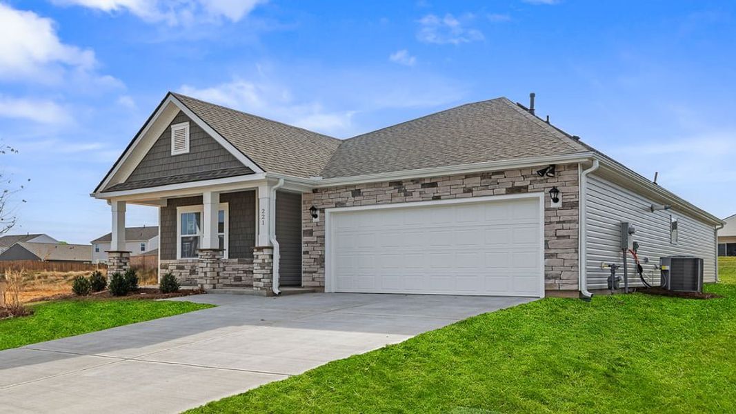Front exterior of a new home in Durbin Meadows Traditions, Fountain Inn, SC, highlighting curb appeal (Image 2).