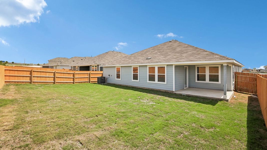 Exterior details and patio area of a home in Prairie Lakes, Buda (Image 24).