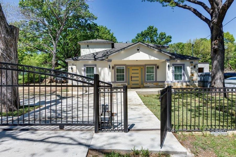 Gate featuring a fenced front yard