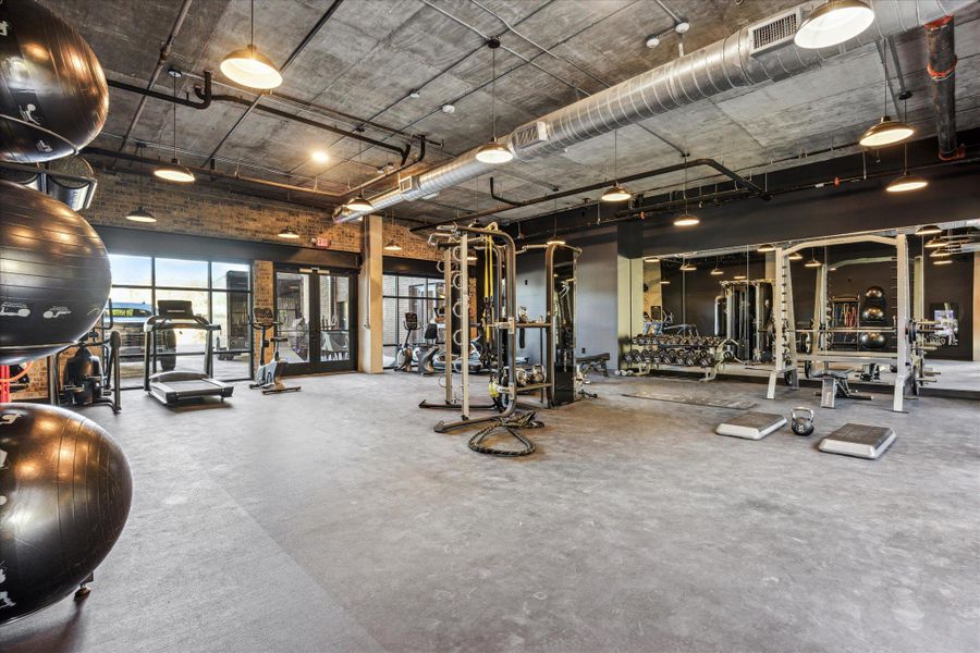 An inviting fitness center awaits, complete with diverse exercise equipment and ample space for invigorating workouts. An inviting fitness center awaits, complete with diverse exercise equipment and ample space for invigorating workouts.
