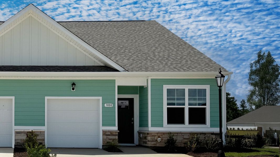 Representative exterior photo of a completed home built from the Belmont by D.R. Horton in Brunswick Plantation, Ash, NC (Image 22). Representative exterior photo of a completed home built from the Belmont by D.R. Horton in Brunswick Plantation, Ash, NC (Image 22).