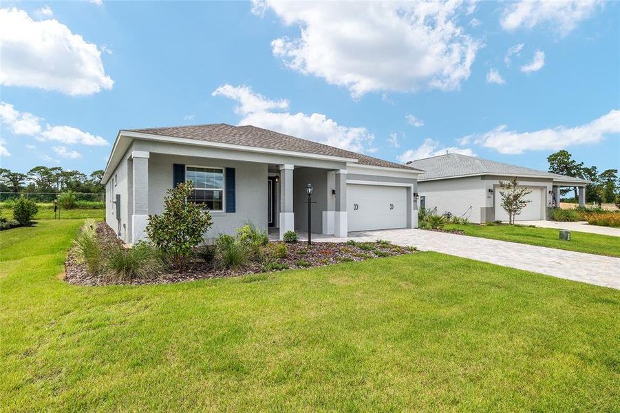 Front exterior of a new home in , Ocala, FL, highlighting curb appeal (Image 29).