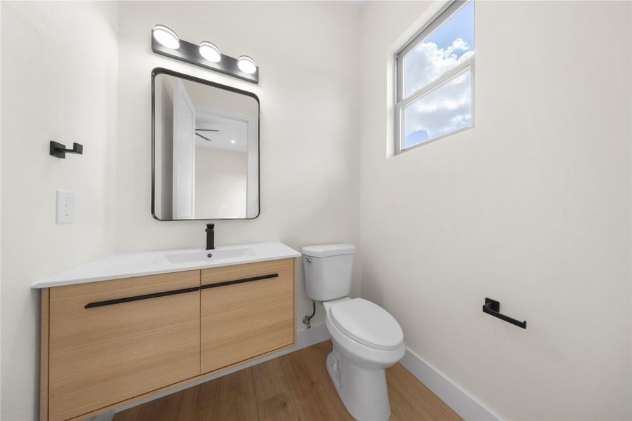 Bathroom featuring light wood-style flooring and vanity Bathroom featuring light wood-style flooring and vanity
