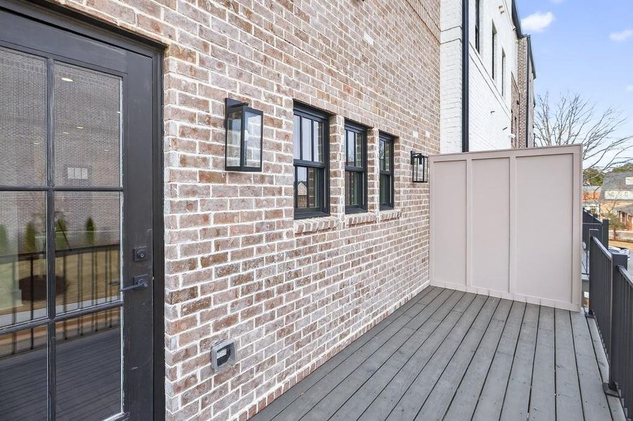Exterior details and patio area of a home in Skyview On Broad, Sugar Hill (Image 21).