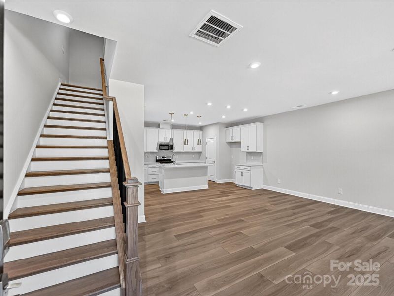 Front Entry With Oak Box Stairs.