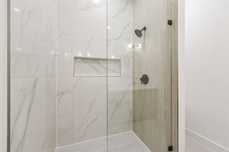 Beautiful tile selections with a soft wood finish allows your shower time to be incredible.