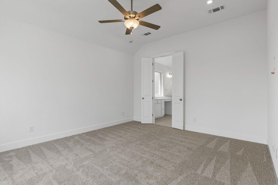 Primary Bedroom with elevated ceiling