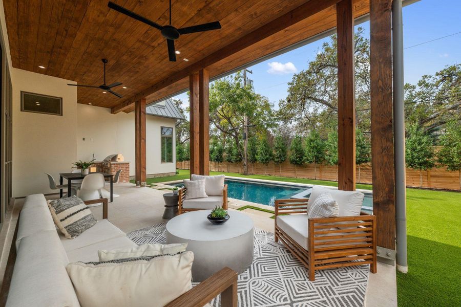 Fenced backyard with outdoor lounge area, a patio area, and ceiling fan Fenced backyard with outdoor lounge area, a patio area, and ceiling fan