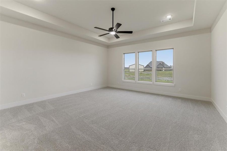 Spacious room featuring gray carpeting and white walls Spacious room featuring gray carpeting and white walls