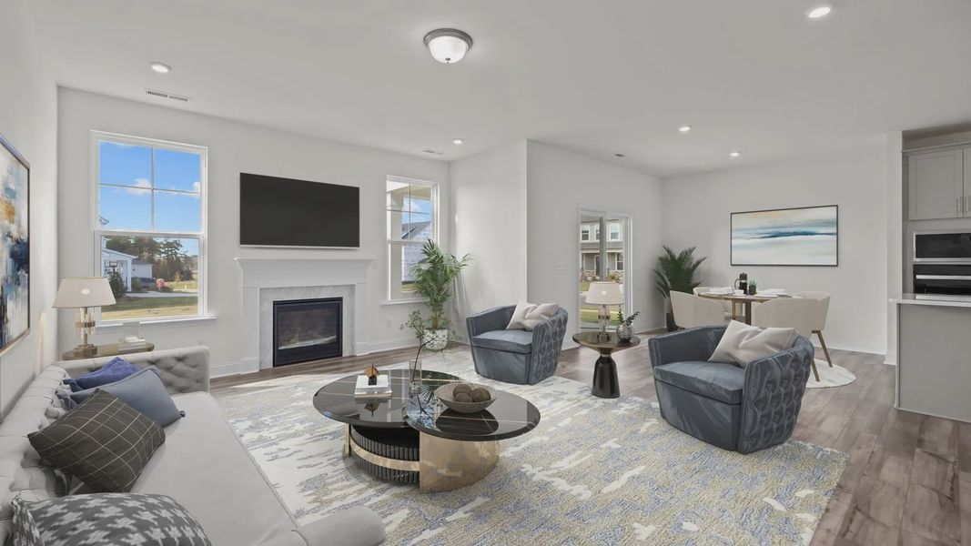 Fairfield open floor concept family room, eat-in breakfast, and gourmet kitchen, at Lakeside Glen by DRB Homes, York, SC.