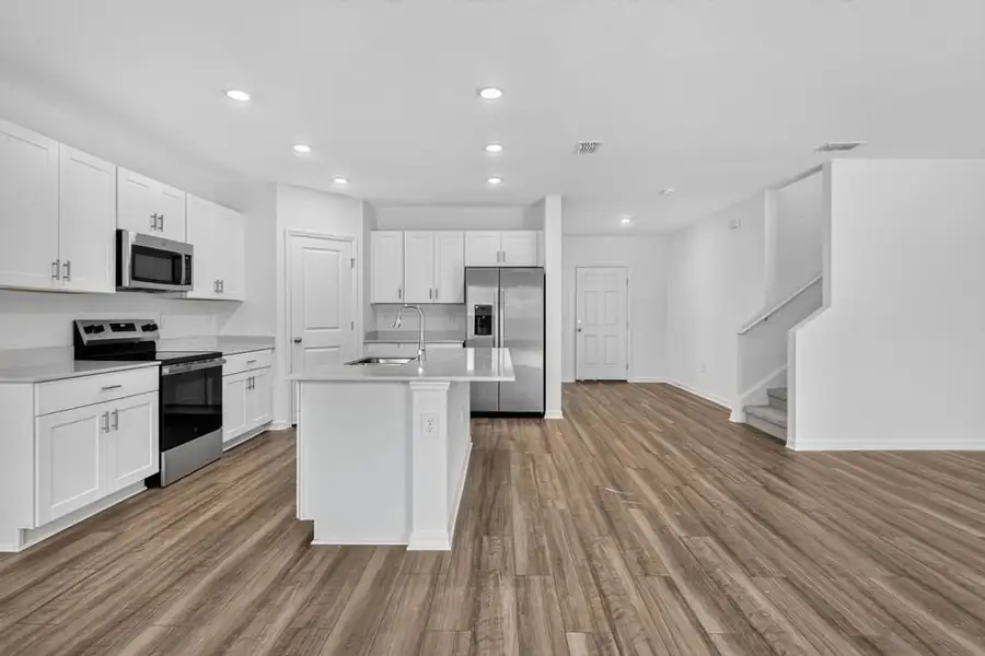 Representative furnished interior of a home built from the Kingfisher by Taylor Morrison in Palm Wind, Hudson (Image 5).